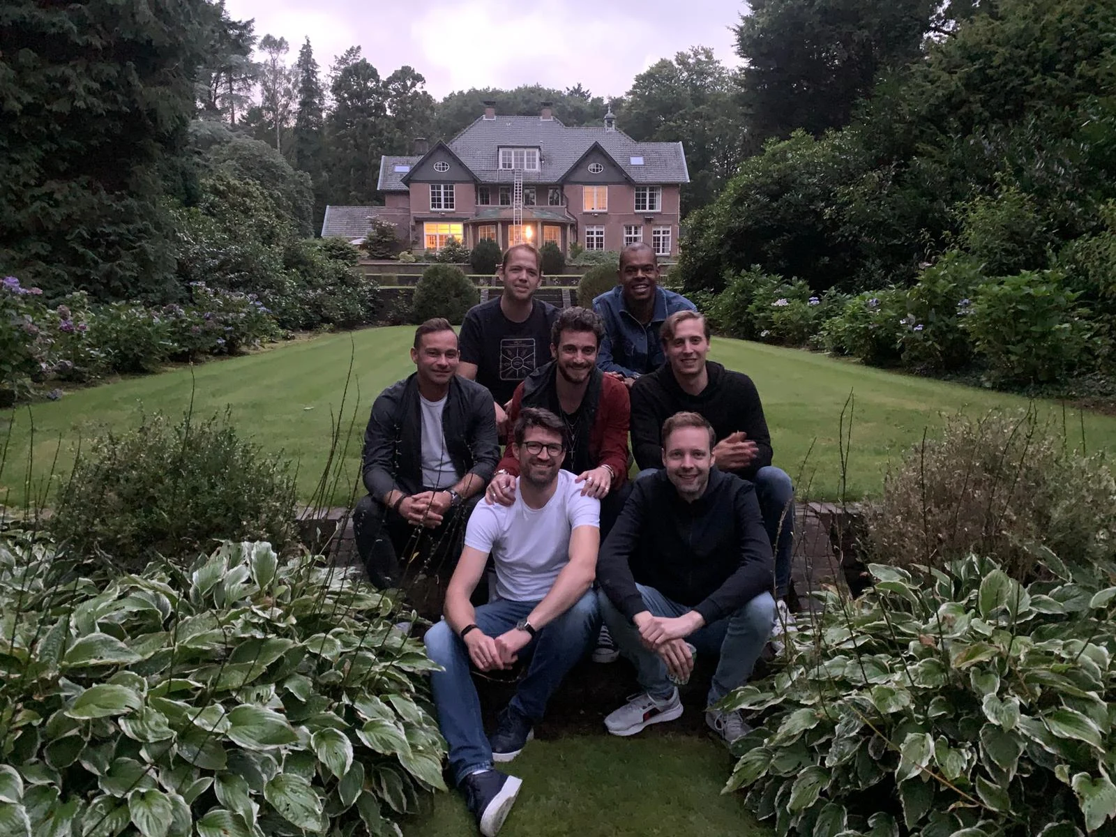 Freddie with friends and colleagues at a house